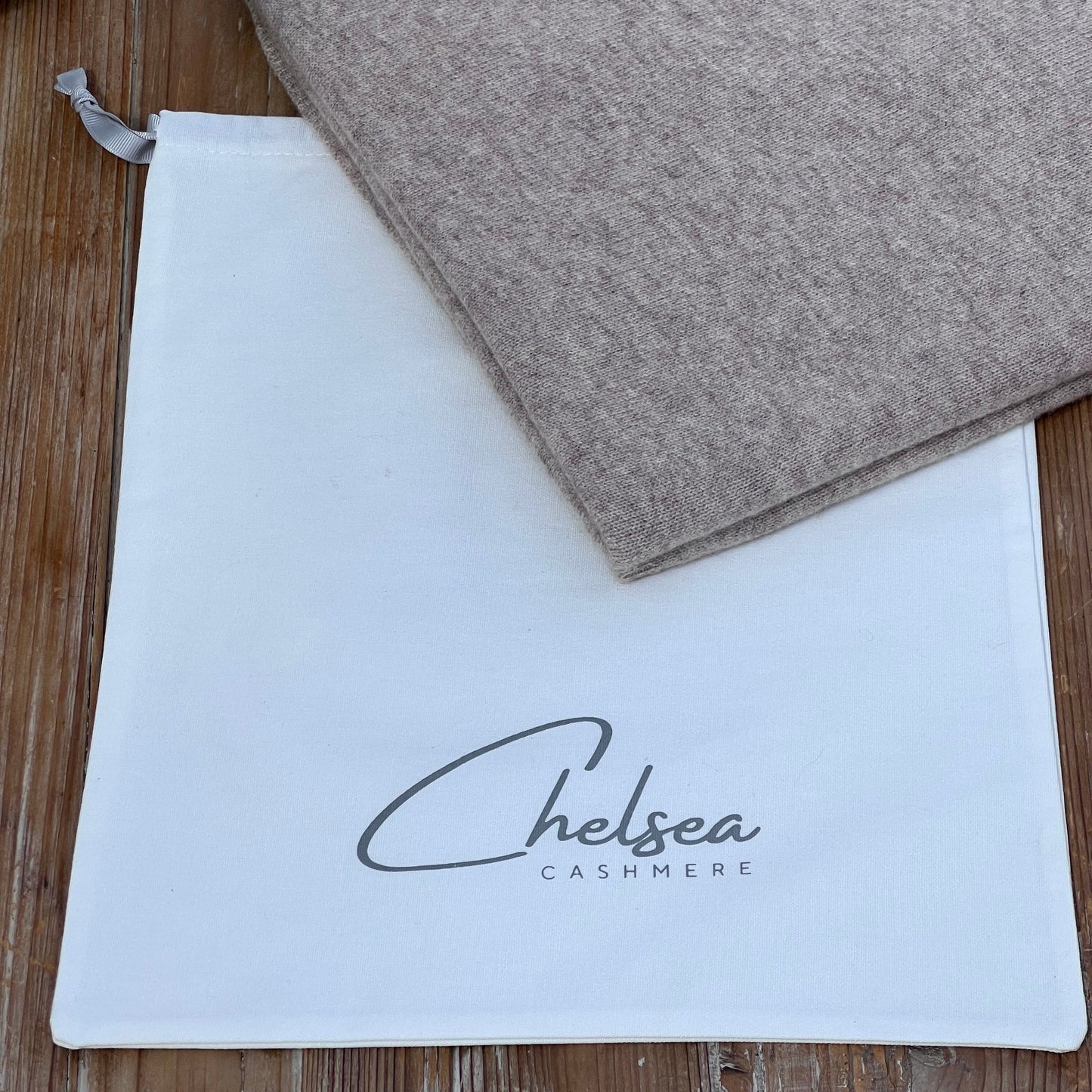 Sand Cashmere Travel Wrap on a white Chelsea Cashmere dust bag