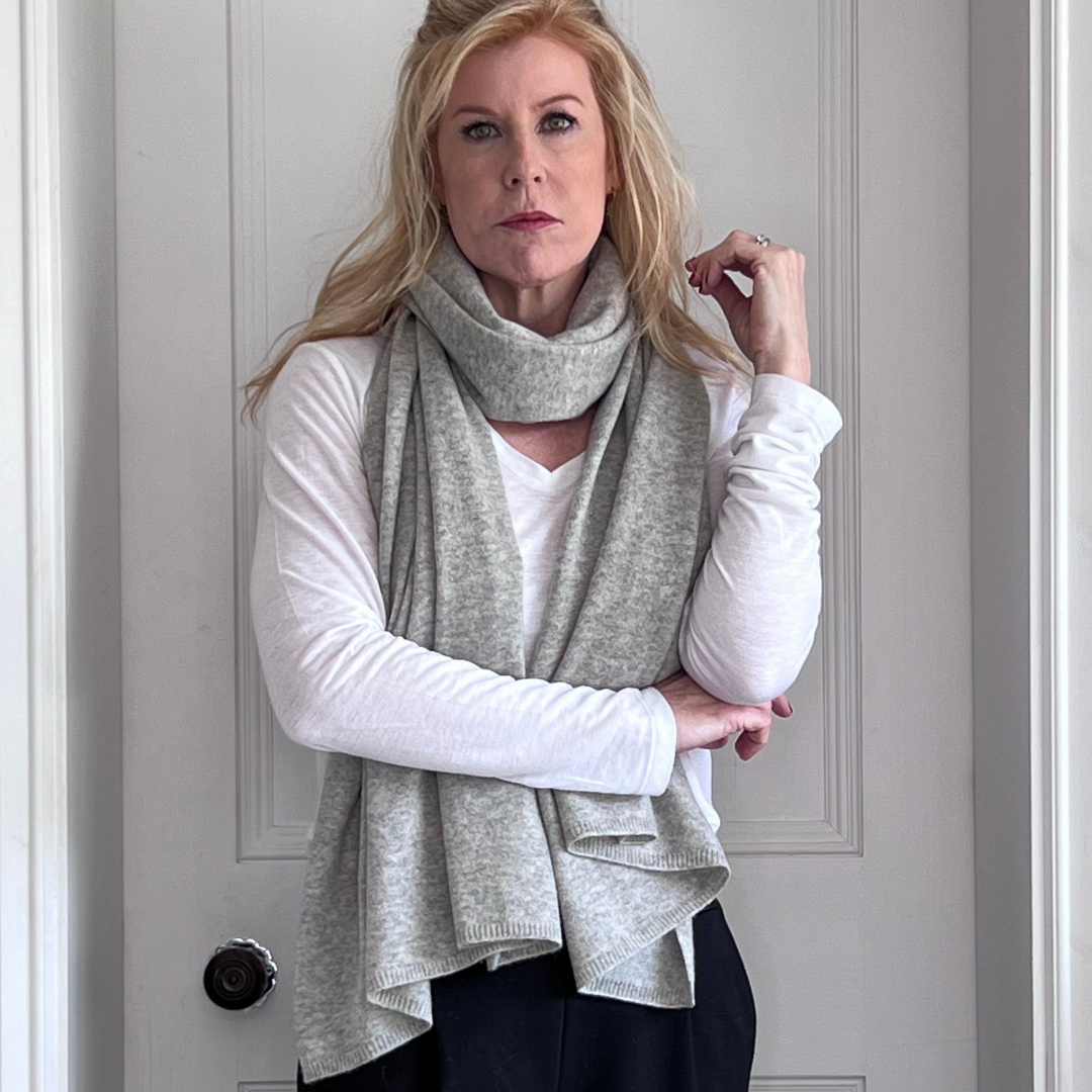 Luxury cashmere scarf worn with black trousers and white longsleeve top